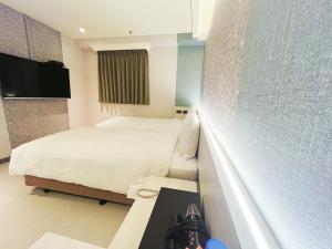 Sjónvarps- og/eða afþreyingartæki á 新仕飯店-New City Hotel