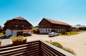 a couple of buildings with a car in a parking lot at Bärenhof in Tirschenreuth