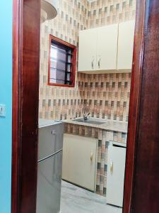 Η κουζίνα ή μικρή κουζίνα στο ABIDJAN CITY Apartment