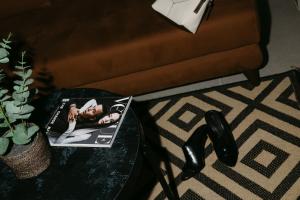 a table with a picture of a woman on it at AIRIO Athens Luxury Suites in Athens