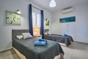 Ένα ή περισσότερα κρεβάτια σε δωμάτιο στο Villa Guadi +59 φωτογραφίες