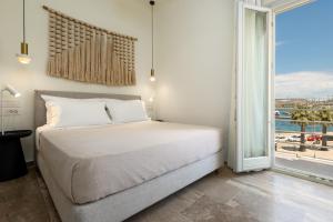 Postel nebo postele na pokoji v ubytování Hotel Oasis