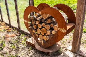 a heart made out of fire wood at Pista bácsi háza in Pusztaföldvár +12 photos