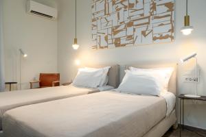 Postel nebo postele na pokoji v ubytování Hotel Oasis