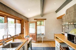 a kitchen with a sink and a counter at La Caseta in Estang