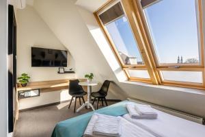 Televízia a/alebo spoločenská miestnosť v ubytovaní Apartamenty Wodna 13