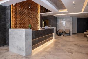 Area lobi atau resepsionis di Nobel Design Hotel