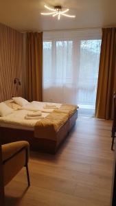 Postel nebo postele na pokoji v ubytování Hotel Felicia + 37 fotografií