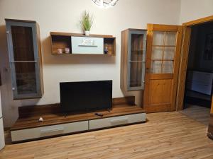 a living room with a flat screen tv on a table at Ferienwohnungen März in Söchtenau