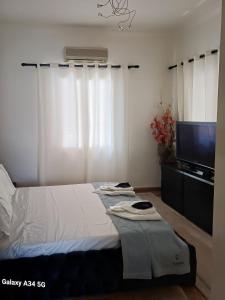 Ένα ή περισσότερα κρεβάτια σε δωμάτιο στο Constantina D Apt Argos