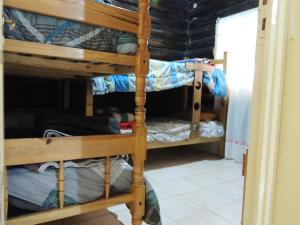 a room with bunk beds in a dorm room at Cabañas San Francisco in Potrerillos
