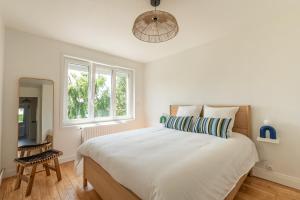 Voodi või voodid majutusasutuse Appartement face Nausicaa , balcon vue mer toas