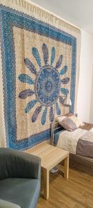 a room with a rug on the wall with a table at Apartment 1 in Altstadt in Angermünde in Angermünde