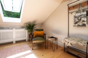 a attic room with a chair and a table at Bowland Lodges in Lancaster +61 photos