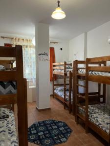 a group of bunk beds in a room at Traveler Hostel 2 in Shkodër +25 photos