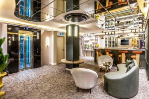 a lobby with chairs and a bar in a building at Sistina Old City Hotel in Istanbul