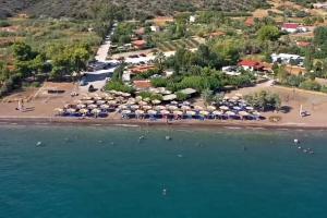 an aerial view of a beach with umbrellas at Villa Helios in Kandia +30 photos