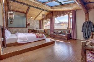Postel nebo postele na pokoji v ubytování Shangri-La Youran Valley Inn