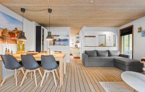 a living room with a couch and a table at 2 Bedroom Lovely Home In Skagen in Skagen