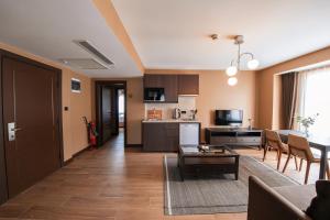 a living room with a couch and a table at Servi House - Trabzon in Trabzon