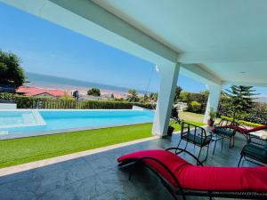 a view of a swimming pool from the patio of a house at RESIDENCE SAPHIR in Mahajanga