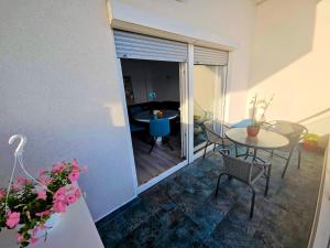 a room with a table and chairs and a dining room at Apartment Nemo in Jesenice +7 photos