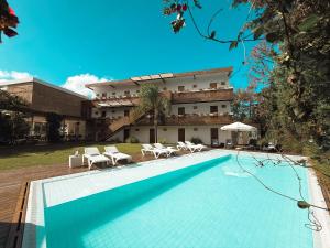 a swimming pool in front of a building at Live Hotel Boutique (Adults only) in Punta del Este