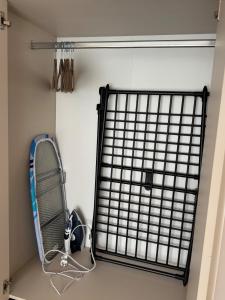 a room with a tennis racket and a net at Seaside apartment x Monciškės in Palanga