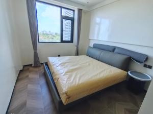 Ένα ή περισσότερα κρεβάτια σε δωμάτιο στο Phoenix Apartments凤凰城公寓