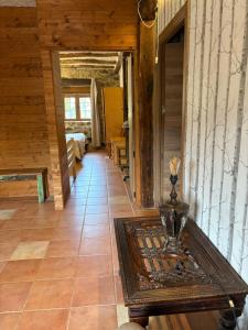 a hallway of a house with a table on a floor at Agroturismo Gure Naia in Carranza