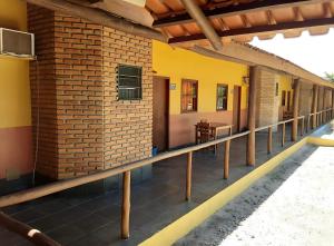 an outside view of a house with a balcony at Patipe Praia Hotel in Canavieiras