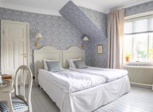 Postel nebo postele na pokoji v ubytování Villa Gransholm