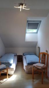 Postel nebo postele na pokoji v ubytování APARTMENT Eva in OBDACH