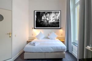 Postel nebo postele na pokoji v ubytování Hotel Lucca