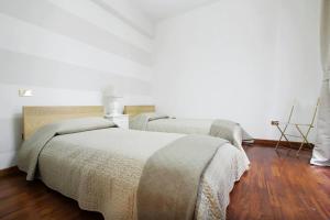 A bed or beds in a room at Holidays Banchi Nuovi