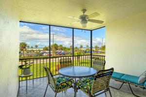 a balcony with a table and chairs and a view at Crescent Royale Condominiums 205 in Siesta Key