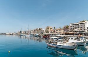 a group of boats are docked in a harbor at Meliti apartment kalamata in Kalamata
