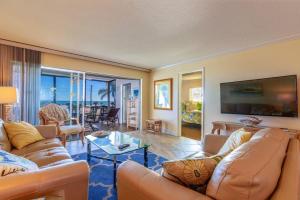 a living room with a couch and a table at Crescent Royale Condominiums 301 in Siesta Key