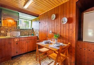 a dining room with a table and chairs in a kitchen at Next To The Spa Wlan Garden Parking Lot in Bad Zurzach