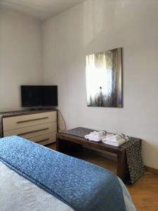 Letto o letti in una camera di IL GIARDINO FIORITO Luxury Guest House B & B