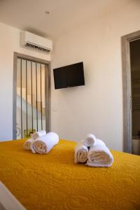 TV a/nebo společenská místnost v ubytování La Corte di Giovanni - Guest House