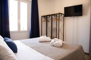 Postel nebo postele na pokoji v ubytování La Corte di Giovanni - Guest House + 14 fotografií