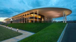 a large building with lights in front of it at HM Residence 11pax Setia City Convention in Shah Alam