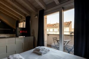 Cama o camas de una habitación en Rooftop Corso Como con terrazzo privato