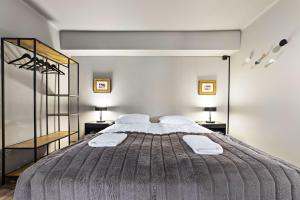 Katil atau katil-katil dalam bilik di Astro Apartments
