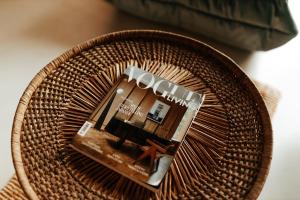 a rattan basket with a picture of a house at TULUM APARTAMENT-Top Design-FREE GARAGE-BATH-Projector-View-GYM-Wine-Next to SPODEK, MCK, NOSPR in Katowice