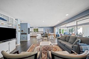 a living room with a couch and a tv at Southhavenking- King Beds In This Home On The Lake in South Haven