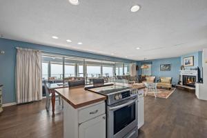 a kitchen and living room with a view of the ocean at Southhavenking- King Beds In This Home On The Lake in South Haven