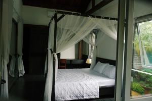 Postel nebo postele na pokoji v ubytování An Nhien Homestay - Relaxing Home