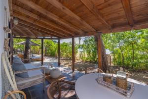 an outdoor patio with a table and chairs at Amouage Boutique Home in Skiathos +78 photos